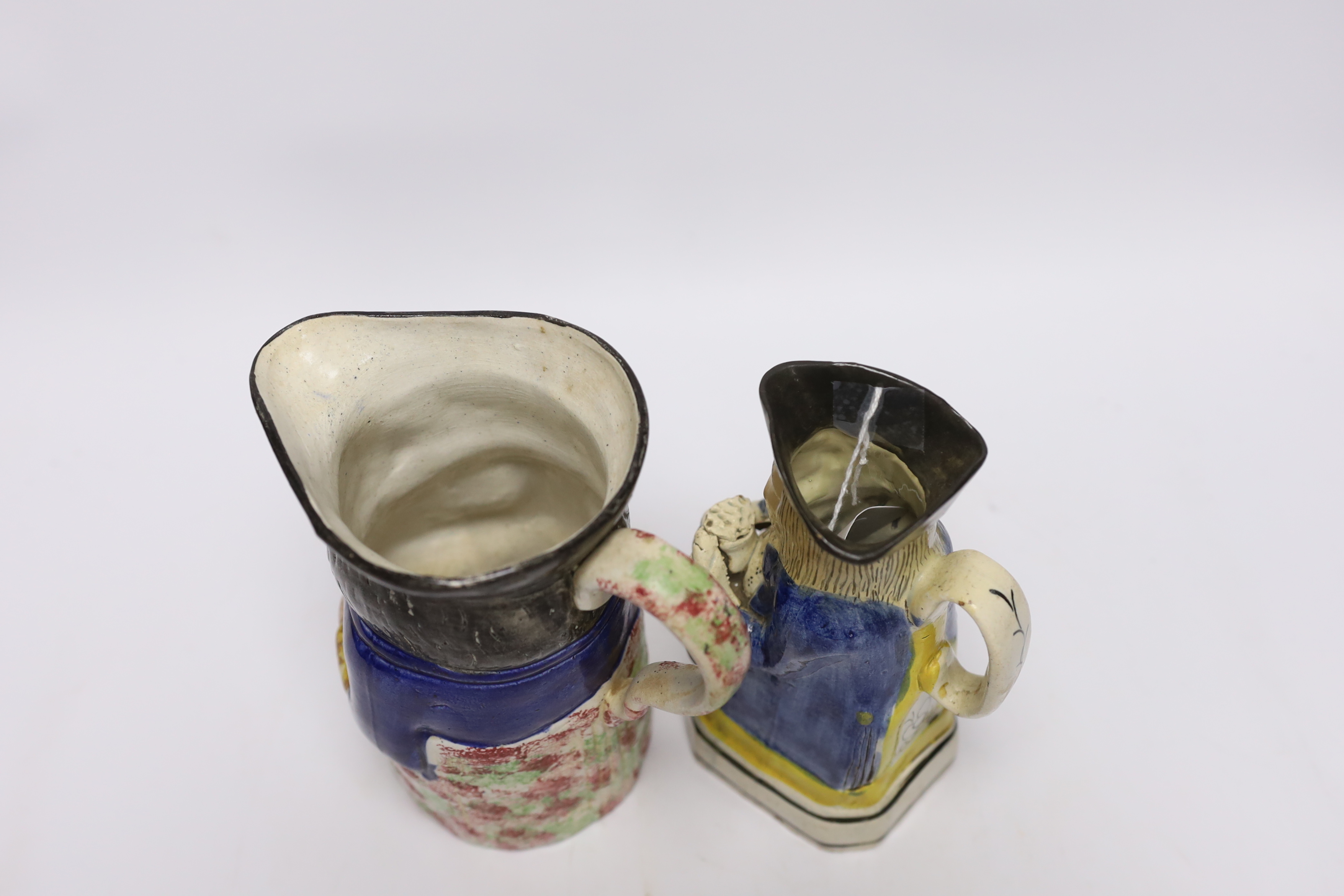 A pearlware Toby jug, c.1795 and late 19th century Staffordshire Toby jug, tallest 19cm